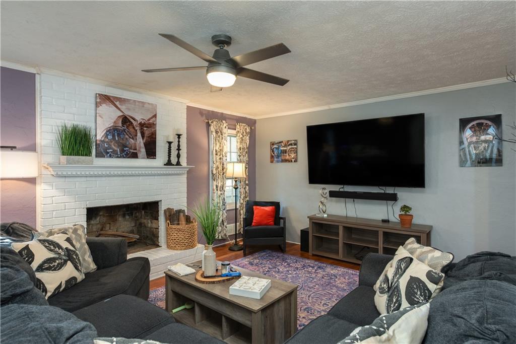 2598 Mountain View Road Snellville, GA 30078 - Photo 6 of 33 a living room with furniture and a flat screen tv