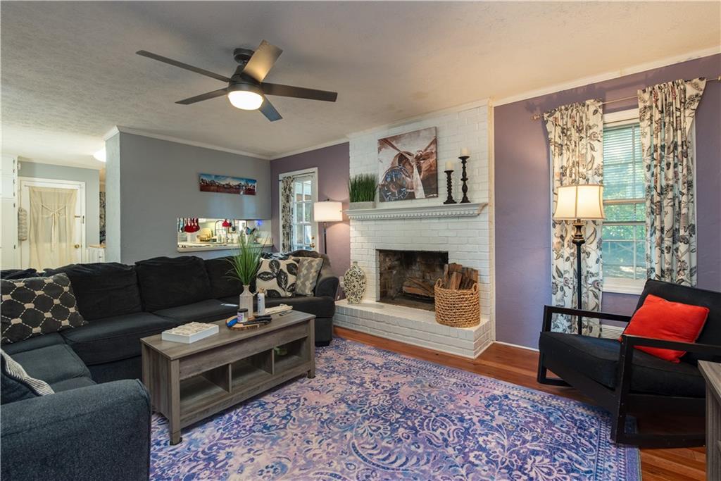2598 Mountain View Road Snellville, GA 30078 - Photo 7 of 33 a living room with furniture and a fireplace