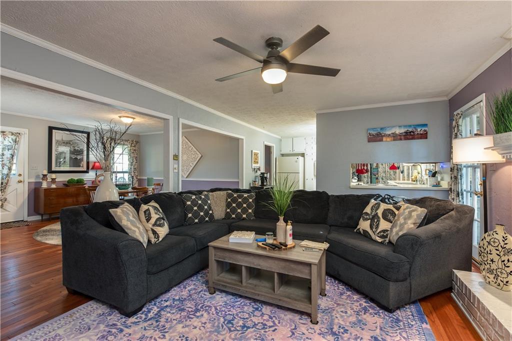 2598 Mountain View Road Snellville, GA 30078 - Photo 8 of 33 a living room with furniture and a wooden floor