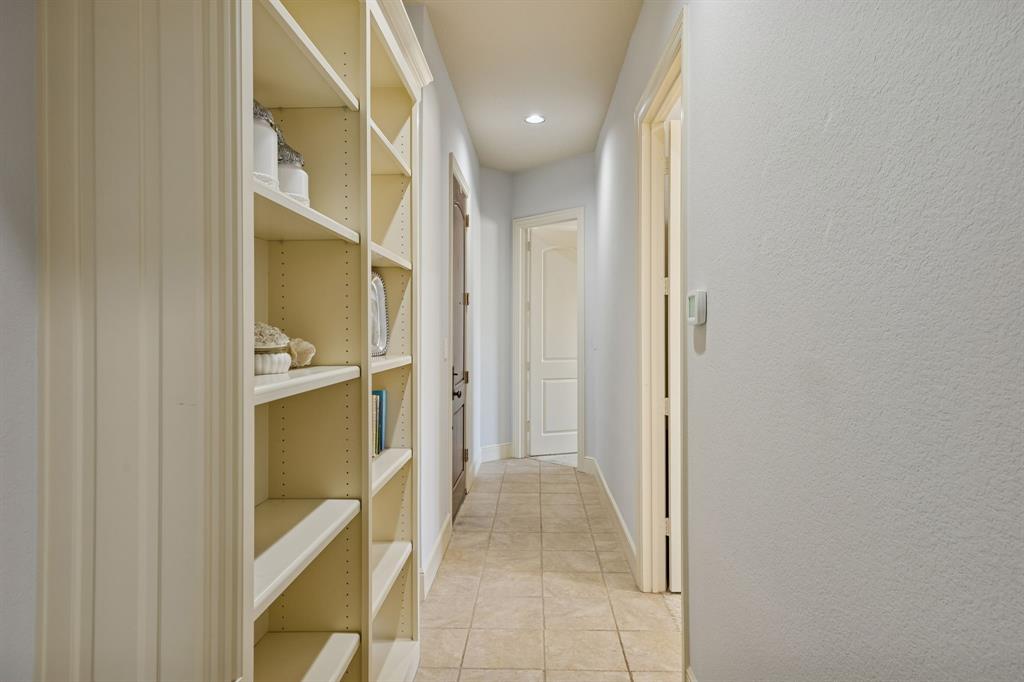 1520 Snider Court Lucas, TX 75002 - Photo 20 of 40 Built in bookcases in the back hall across from the office serves a great storage and function of this full service suite.