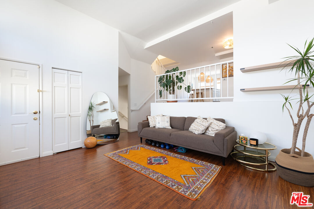 1001 Figueroa Terrace, Unit 305 Los Angeles, CA 90012 - Photo 1 of 18 a living room with furniture and a wooden floor