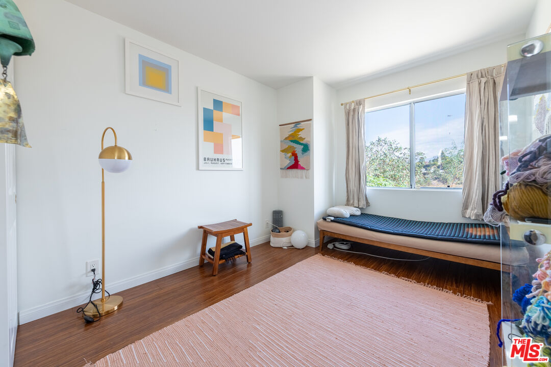 1001 Figueroa Terrace, Unit 305 Los Angeles, CA 90012 - Photo 13 of 18 a living room with furniture and a wooden floor