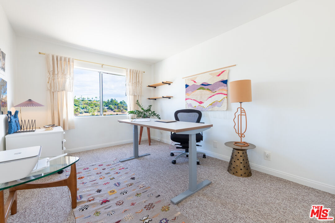 1001 Figueroa Terrace, Unit 305 Los Angeles, CA 90012 - Photo 15 of 18 a living room with furniture and a window