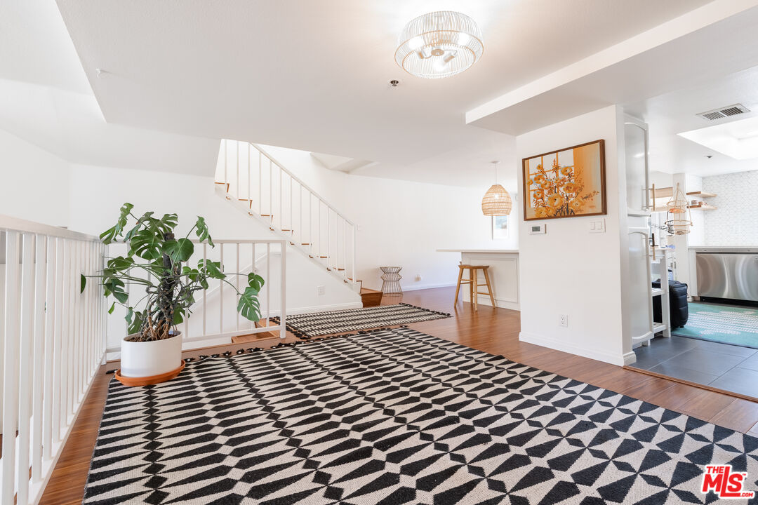 1001 Figueroa Terrace, Unit 305 Los Angeles, CA 90012 - Photo 3 of 18 a bedroom with furniture and a window