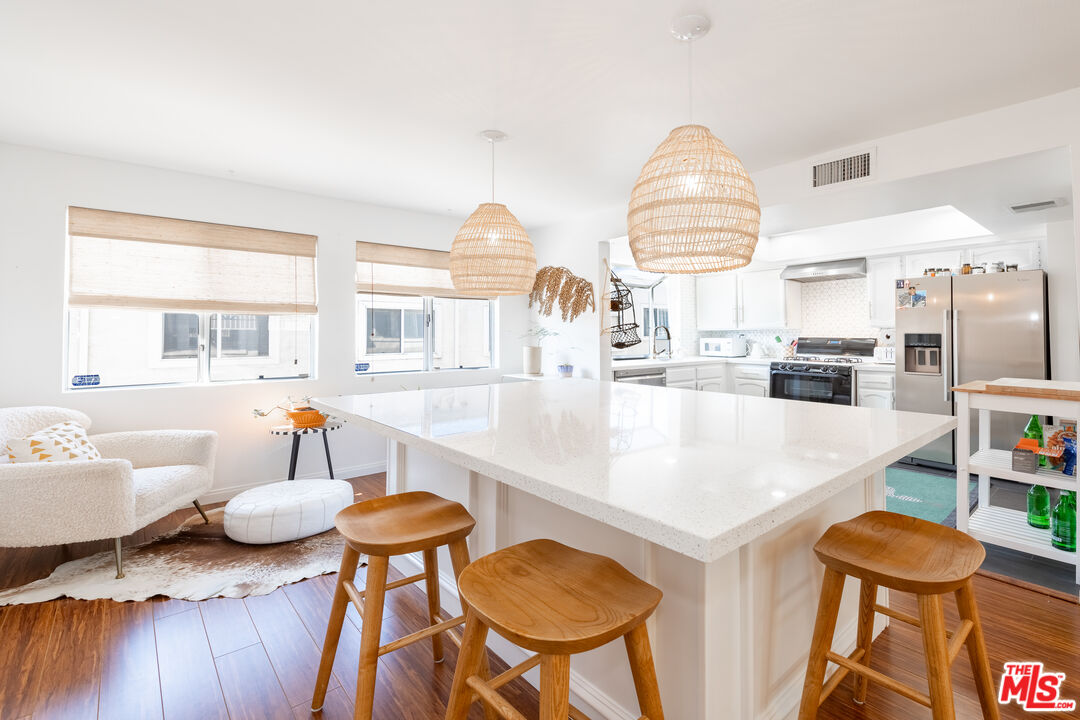1001 Figueroa Terrace, Unit 305 Los Angeles, CA 90012 - Photo 7 of 18 a living room with furniture and a table