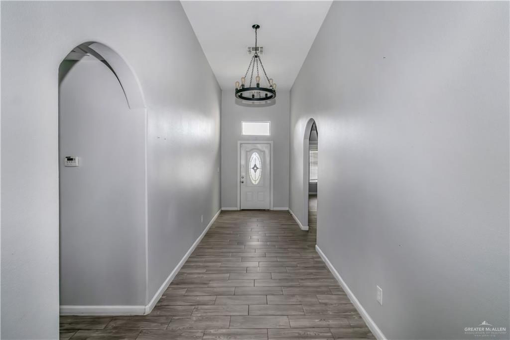 4117 South Las Nubes Street Pharr, TX 78577 - Photo 3 of 18 a view of a hallway with wooden floor
