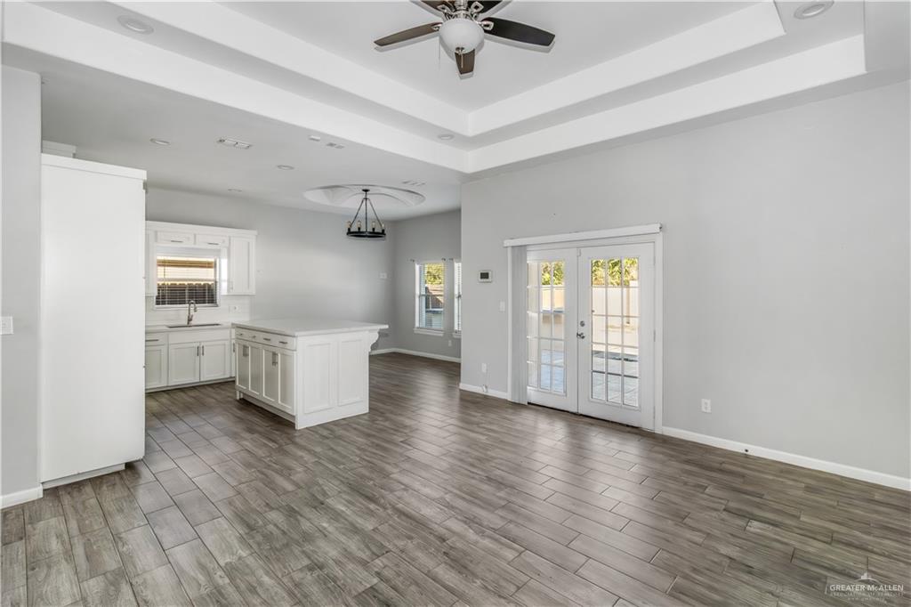 4117 South Las Nubes Street Pharr, TX 78577 - Photo 4 of 18 a view of an empty room with window and wooden floor