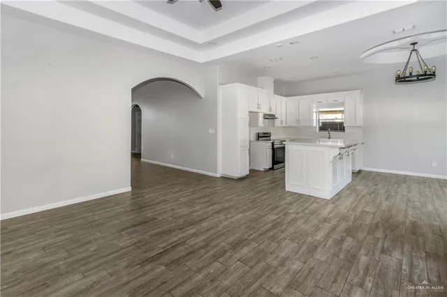 a view of a kitchen with wooden floor