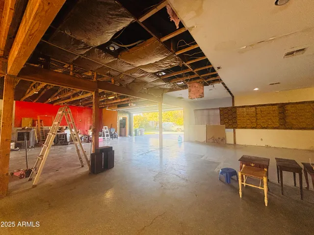 a view of a studio with wooden floor
