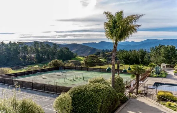 a view of a cafe with sitting area