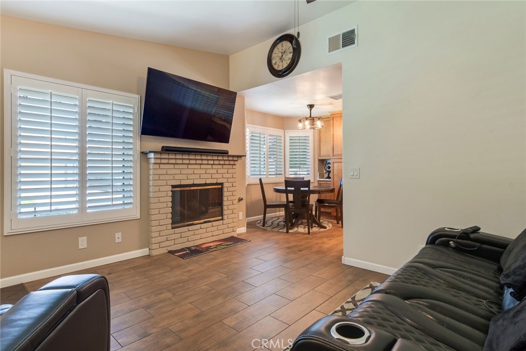 3198 Bexfield Court Riverside, CA 92503 - Photo 7 of 33 Living Room with Wood-Like Porcelian Tile and Gas Fireplace