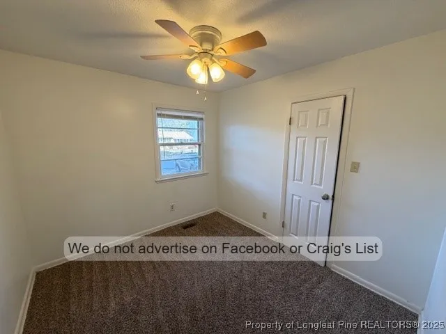 a view of a livingroom with hardwood floor and a ceiling fan