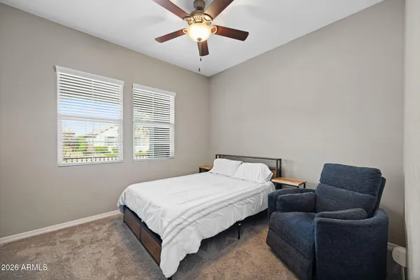 a large kitchen with kitchen island a sink dishwasher a stove and a refrigerator with wooden floor