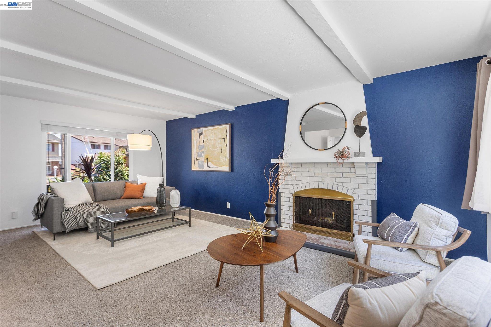 16683 Kildare Road Castro Valley, CA 94546 - Photo 13 of 77 a living room with furniture a fireplace and a potted plant