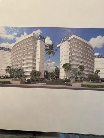 a close up of a kitchen sink with granite countertop