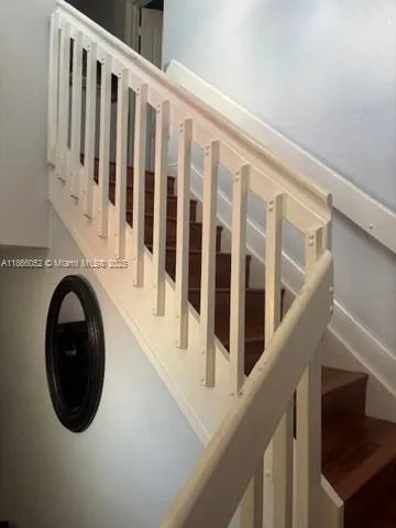 a view of a hallway with washer and dryer