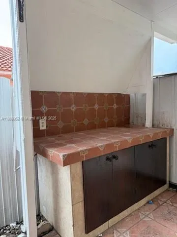 a bathroom with a sink and mirror