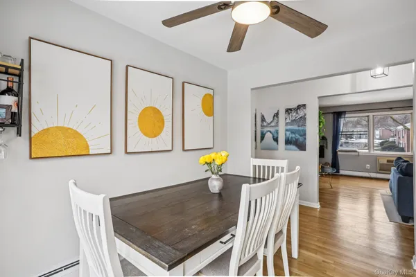 a living room with a table and chairs