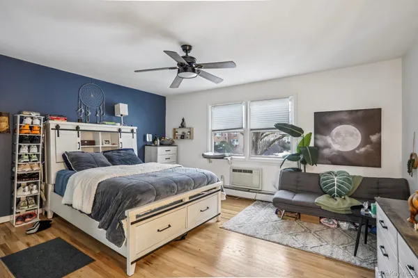 a bedroom with a bed and flat screen tv