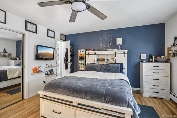 a bed room with a bed and a chandelier