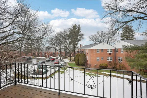 a view of street with a building and with trees