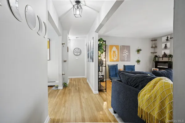 a spacious bedroom with a bed and wooden floor