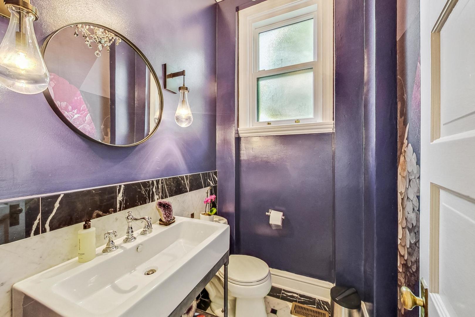 50 MacArthur Loop Highland Park, IL 60035 - Photo 16 of 44 a bathroom with a sink a toilet and mirror