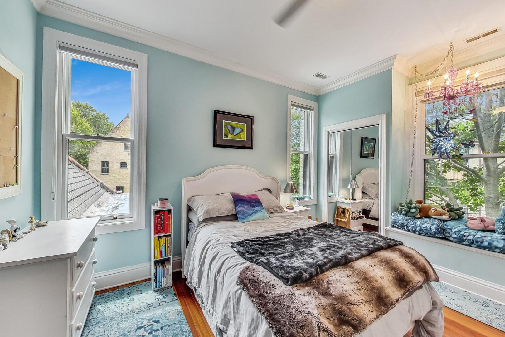 50 MacArthur Loop Highland Park, IL 60035 - Photo 23 of 44 a bedroom with a bed and a dresser next to a window