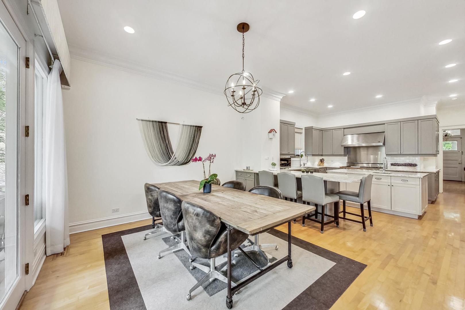50 MacArthur Loop Highland Park, IL 60035 - Photo 10 of 44 a view of a dining room with furniture window and wooden floor