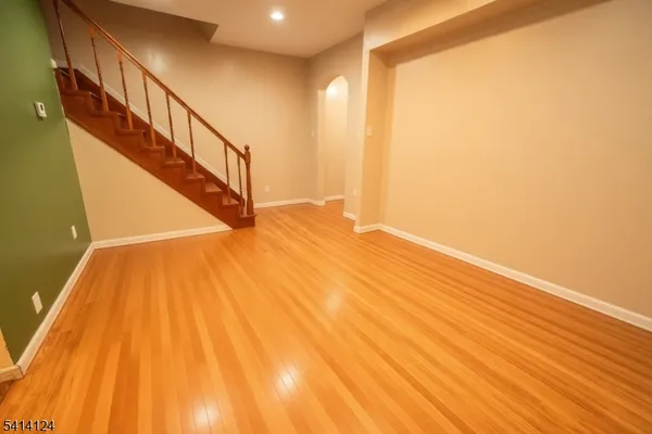 a view of entryway with wooden floor