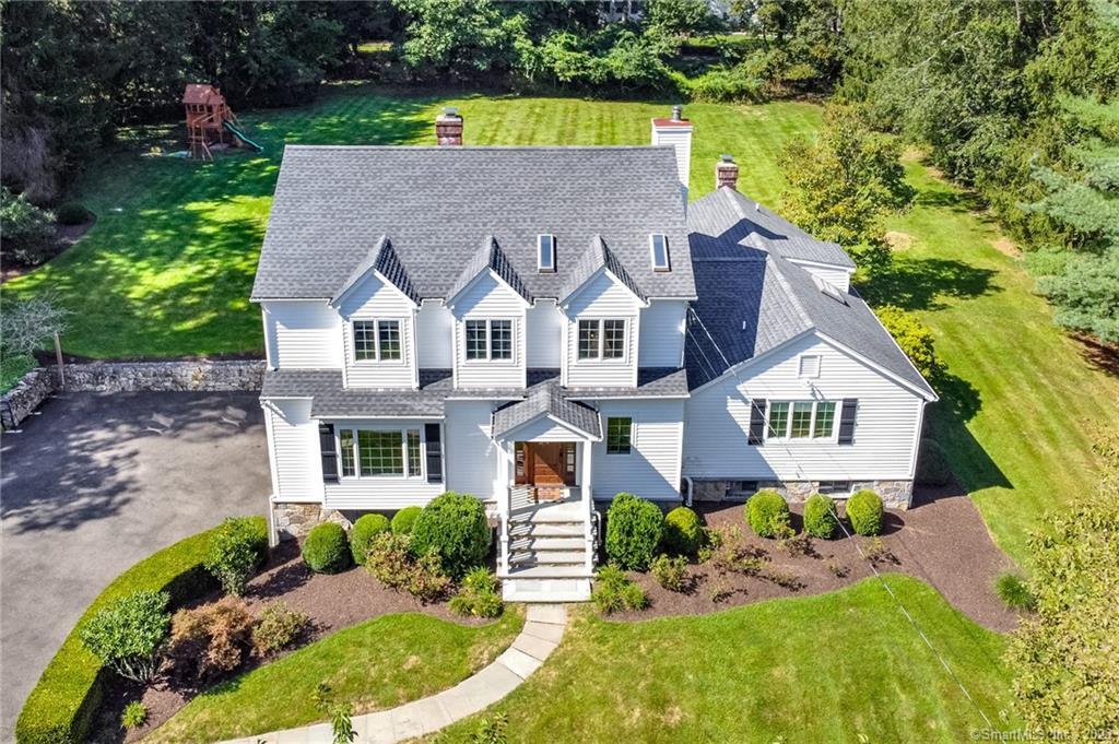 173 West Norwalk Road Norwalk, CT 06850 - Photo 1 of 1 a front view of a house with a garden and plants