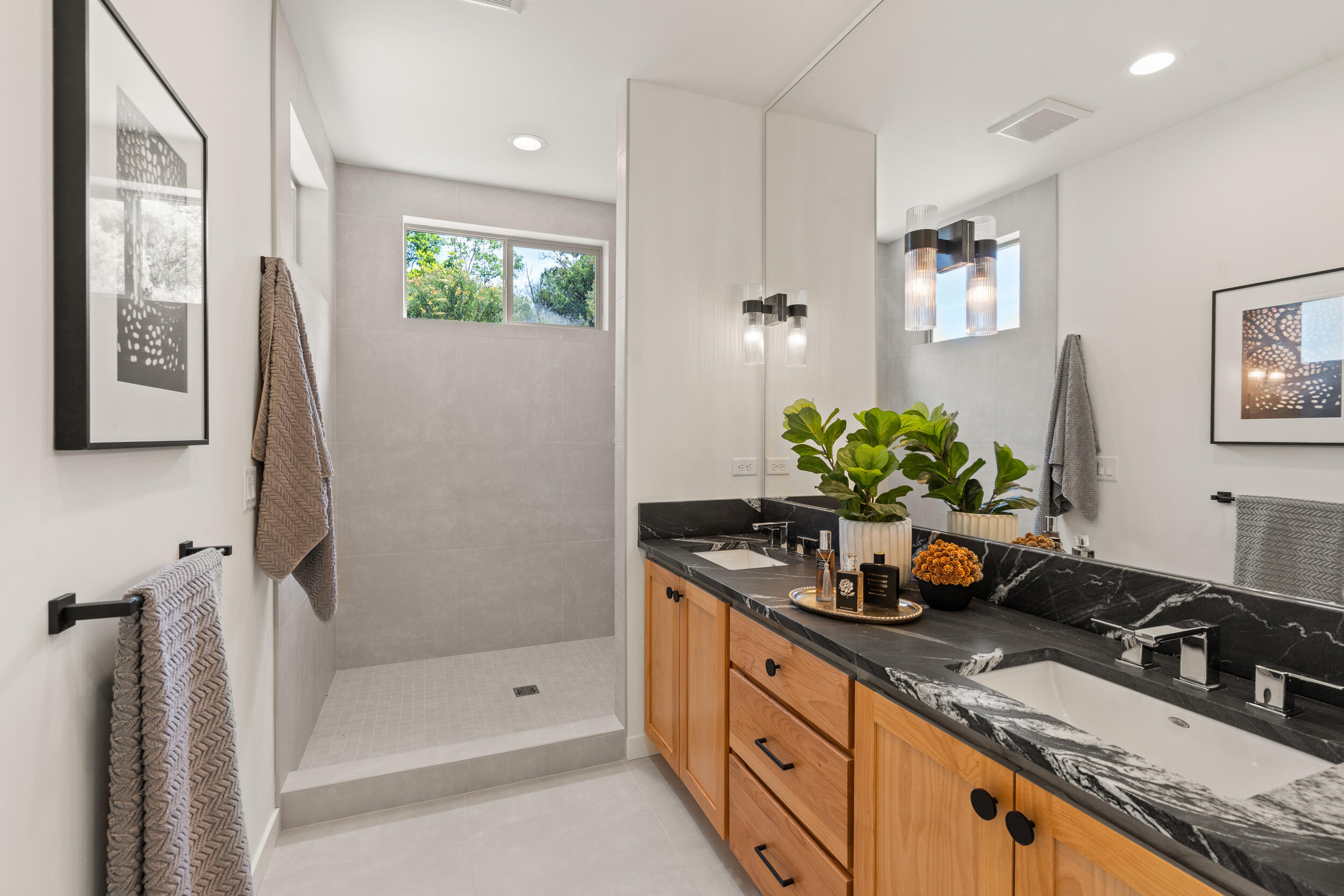 3060 Ashland Mine Road Talent, OR 97540 - Photo 22 of 43 a bathroom with a granite countertop sink a mirror a potted plant and a shower
