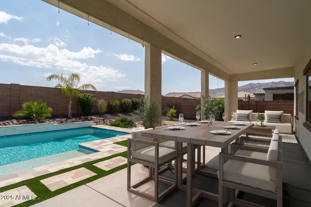 a view of backyard with seating area and roof
