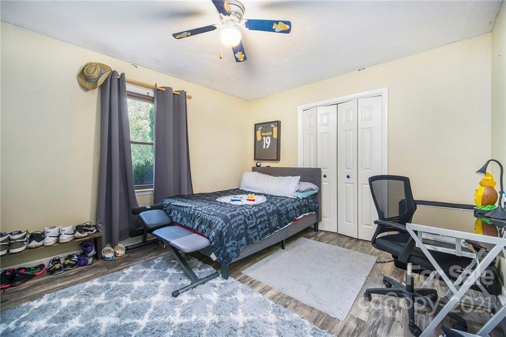 833 Long Branch Road Grover, NC 28073 - Photo 16 of 29 a bedroom with a bed and wooden floor