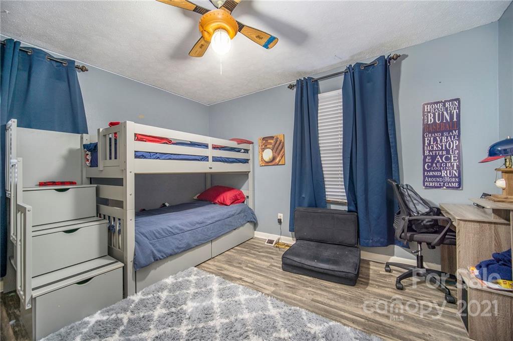 833 Long Branch Road Grover, NC 28073 - Photo 17 of 29 a bedroom with a bed and a window