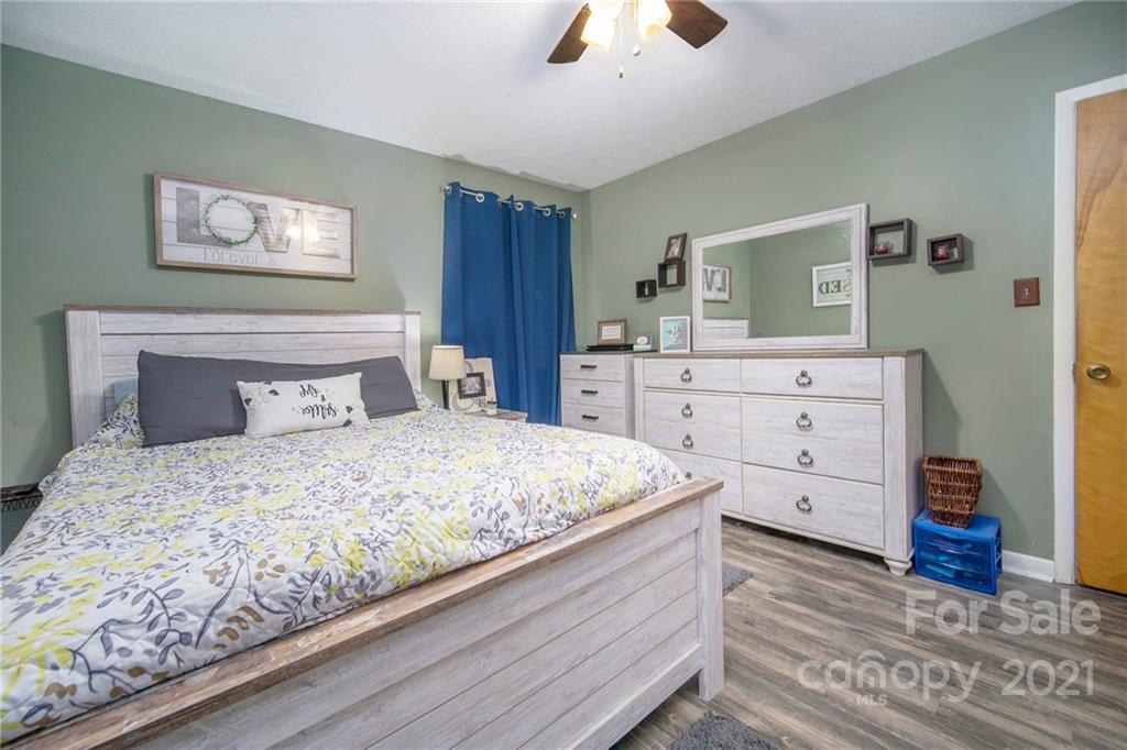 833 Long Branch Road Grover, NC 28073 - Photo 20 of 29 a bedroom with a large bed and a dresser