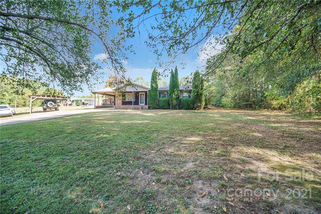 833 Long Branch Road Grover, NC 28073 - Photo 3 of 29 a view of a big yard with large trees