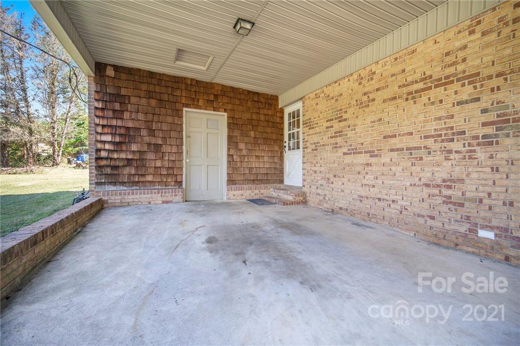 833 Long Branch Road Grover, NC 28073 - Photo 22 of 29 a view of an empty room with a fireplace