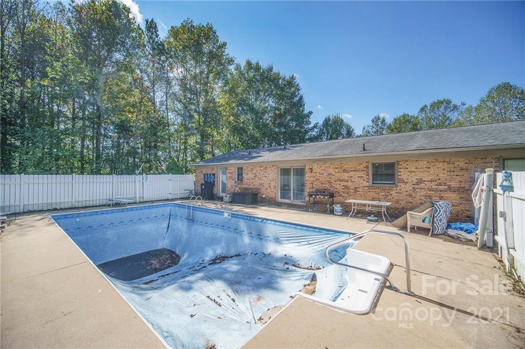 833 Long Branch Road Grover, NC 28073 - Photo 24 of 29 a view of a patio with swimming pool table and chairs