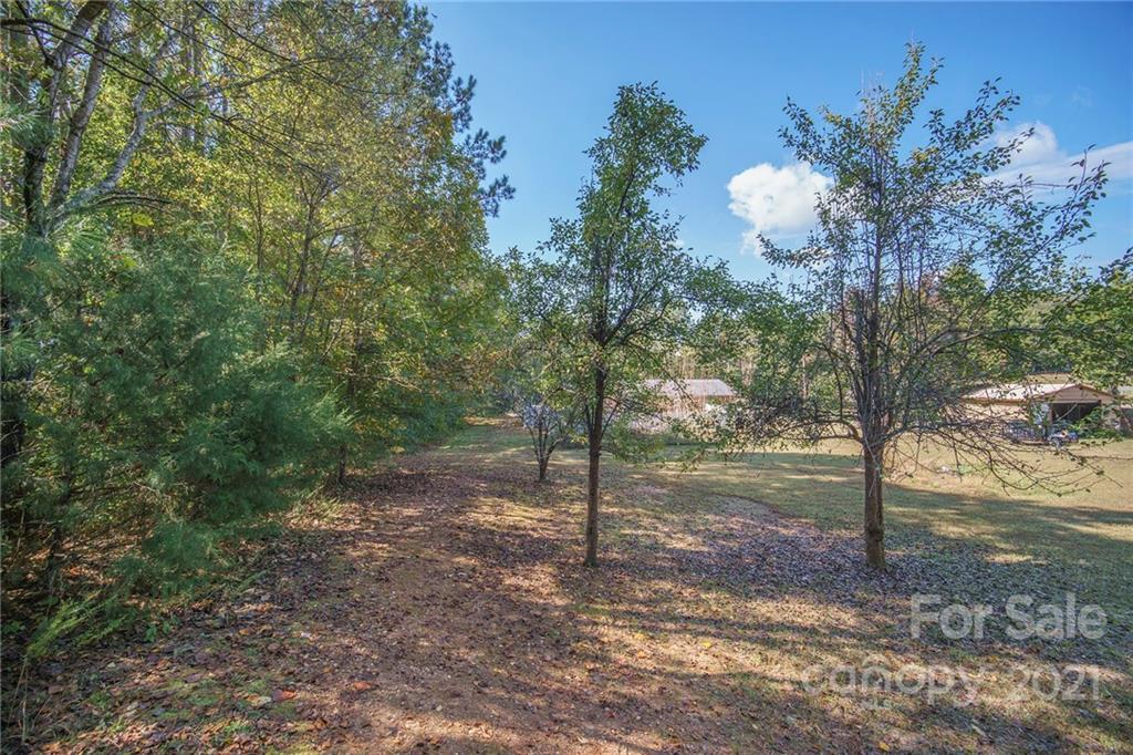 833 Long Branch Road Grover, NC 28073 - Photo 28 of 29 a view of a wooden house with a yard