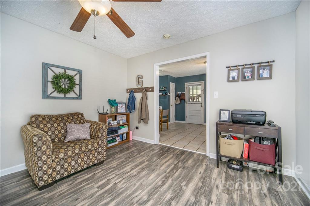 833 Long Branch Road Grover, NC 28073 - Photo 10 of 29 a living room with furniture and a flat screen tv