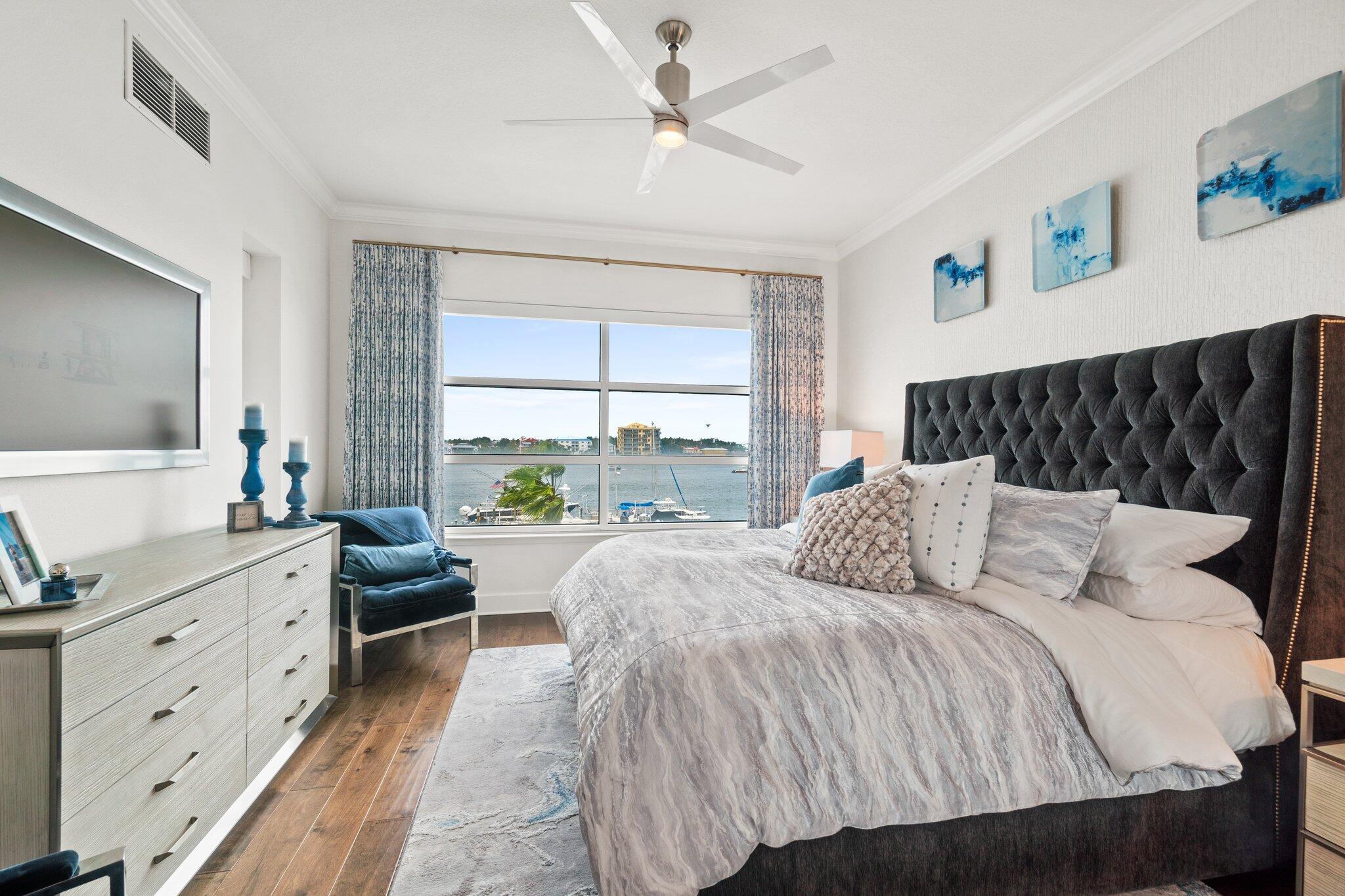 211 Durango Road, Unit 311 Destin, FL 32541 - Photo 23 of 71 a bedroom with a large bed and a flat tv screen on dresser