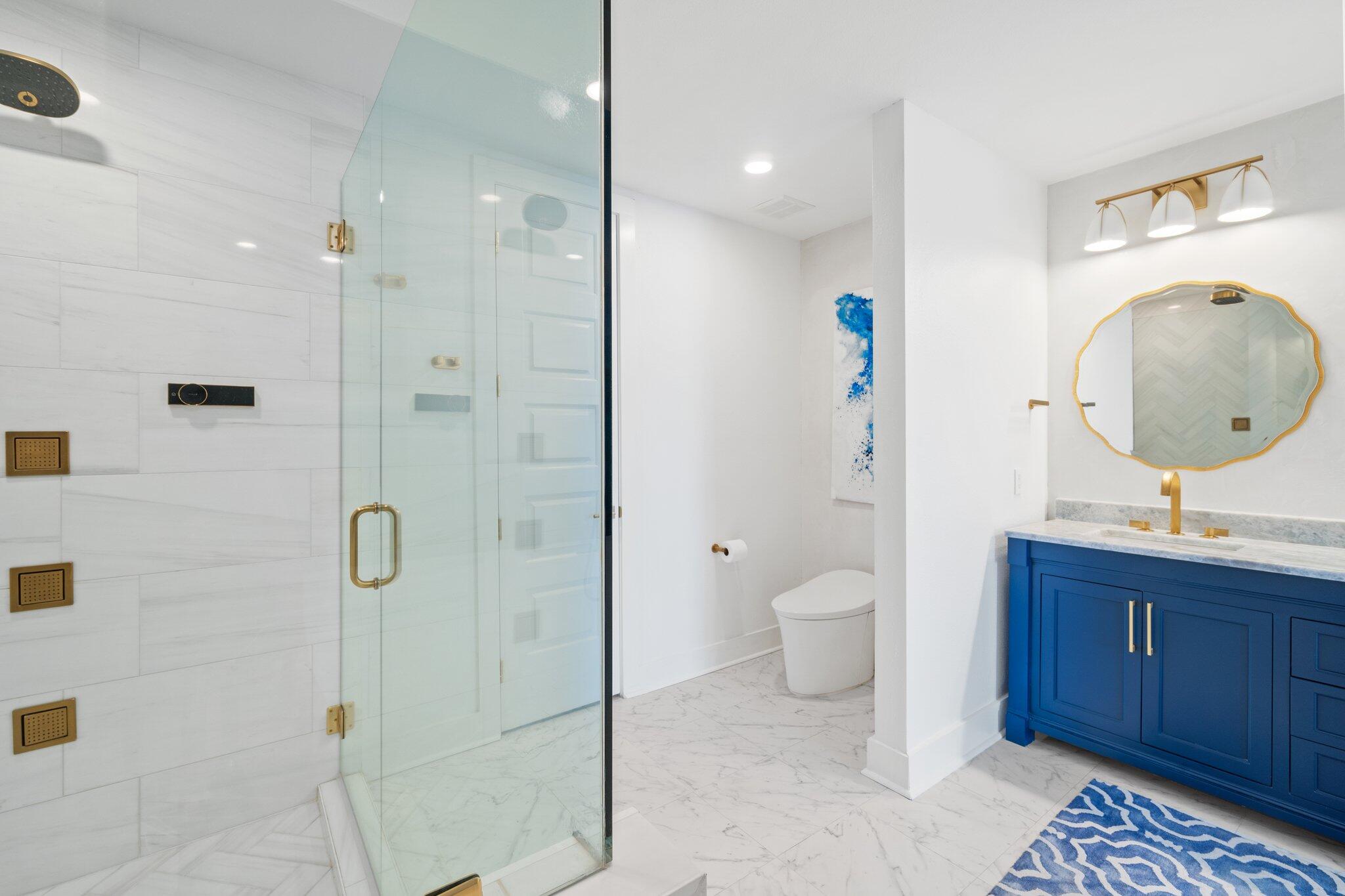 211 Durango Road, Unit 311 Destin, FL 32541 - Photo 26 of 71 a bathroom with a toilet a sink and shower