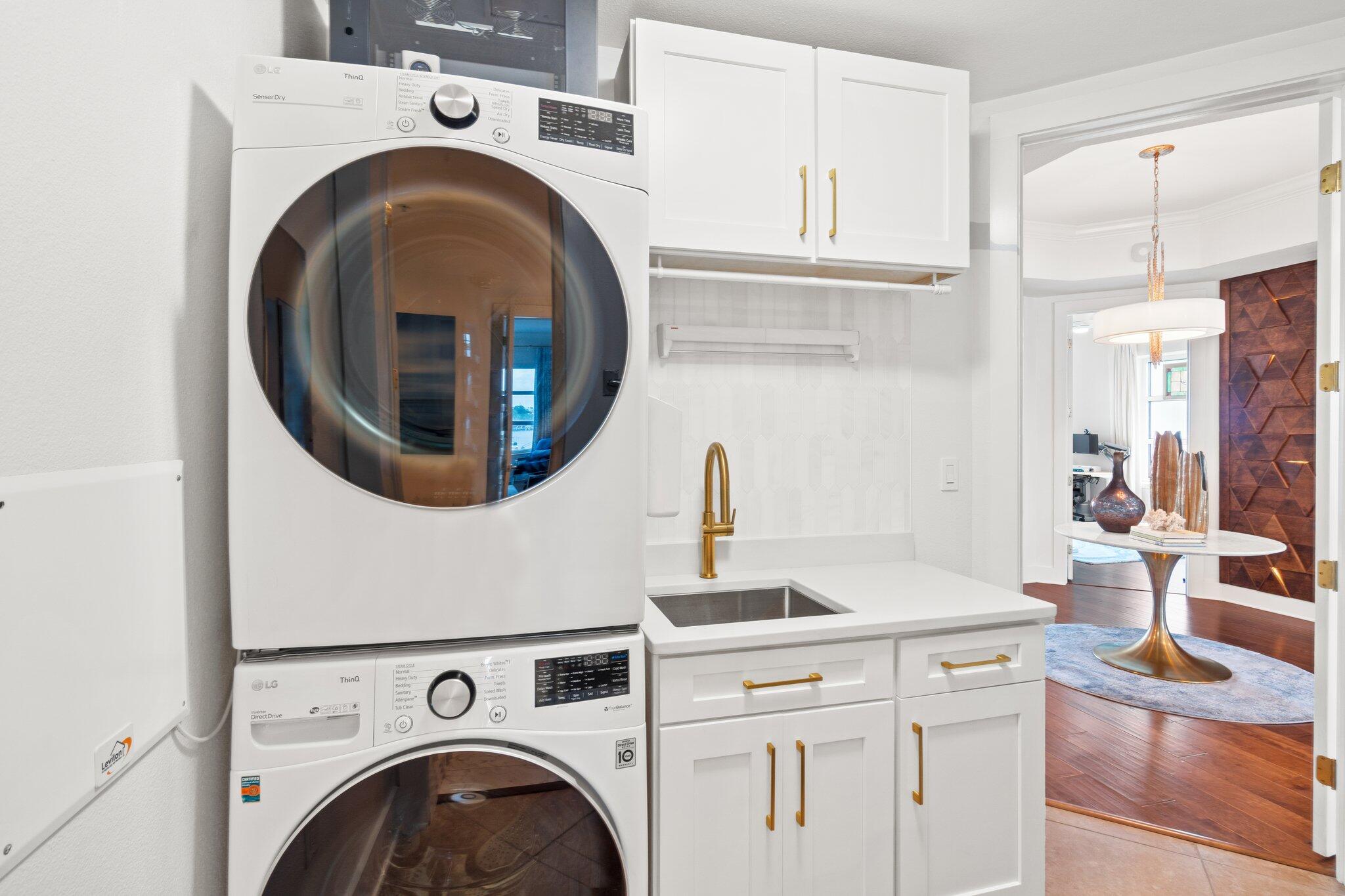 211 Durango Road, Unit 311 Destin, FL 32541 - Photo 27 of 71 a utility room with dryer and washer