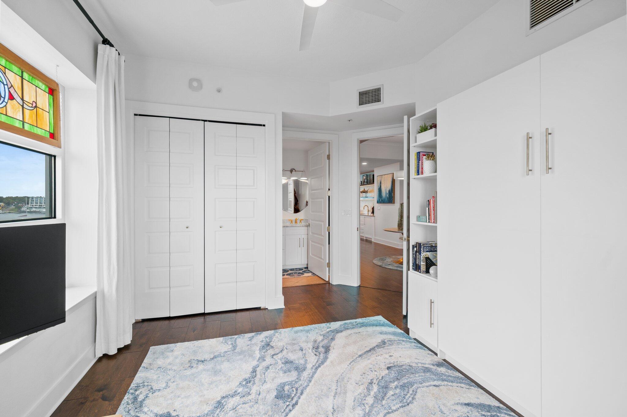 211 Durango Road, Unit 311 Destin, FL 32541 - Photo 30 of 71 a bedroom with a bed and a view of bathroom