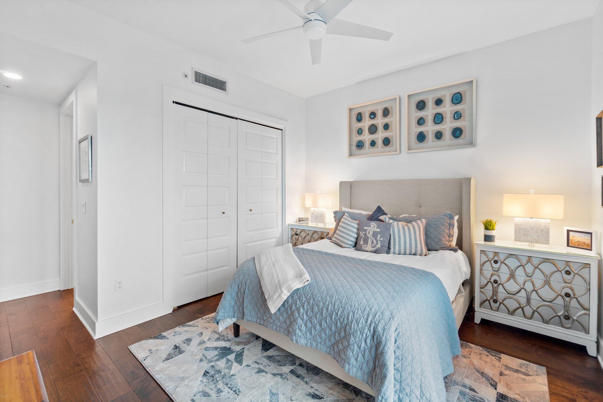 211 Durango Road, Unit 311 Destin, FL 32541 - Photo 41 of 71 a bedroom with a large bed and wooden floor