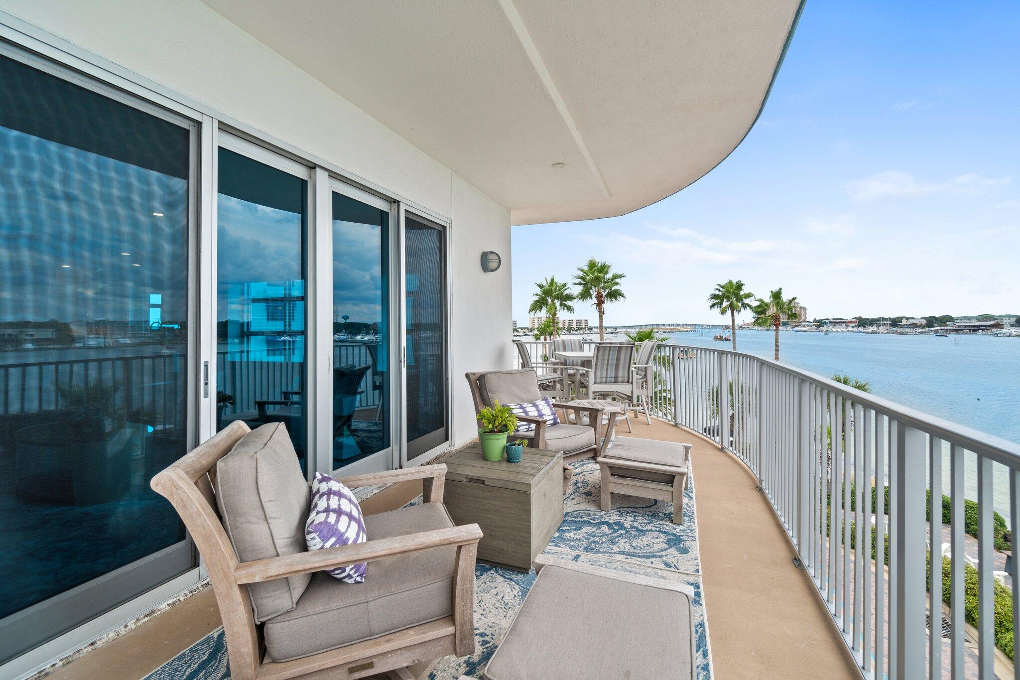 211 Durango Road, Unit 311 Destin, FL 32541 - Photo 49 of 71 a balcony with furniture and a potted plant
