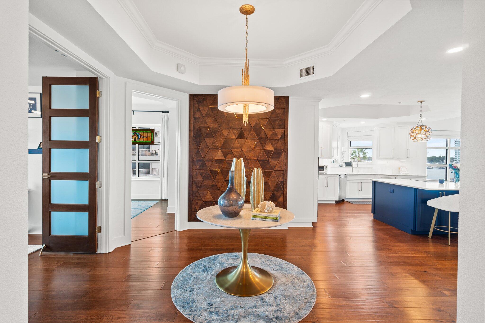 211 Durango Road, Unit 311 Destin, FL 32541 - Photo 5 of 71 a living room with kitchen island furniture and a wooden floor