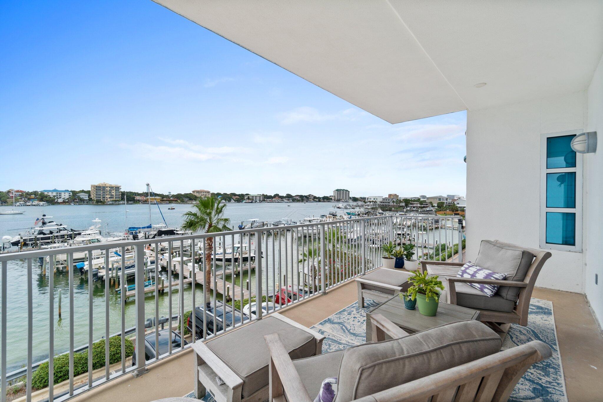 211 Durango Road, Unit 311 Destin, FL 32541 - Photo 52 of 71 a view of a balcony with lake view and wooden floor