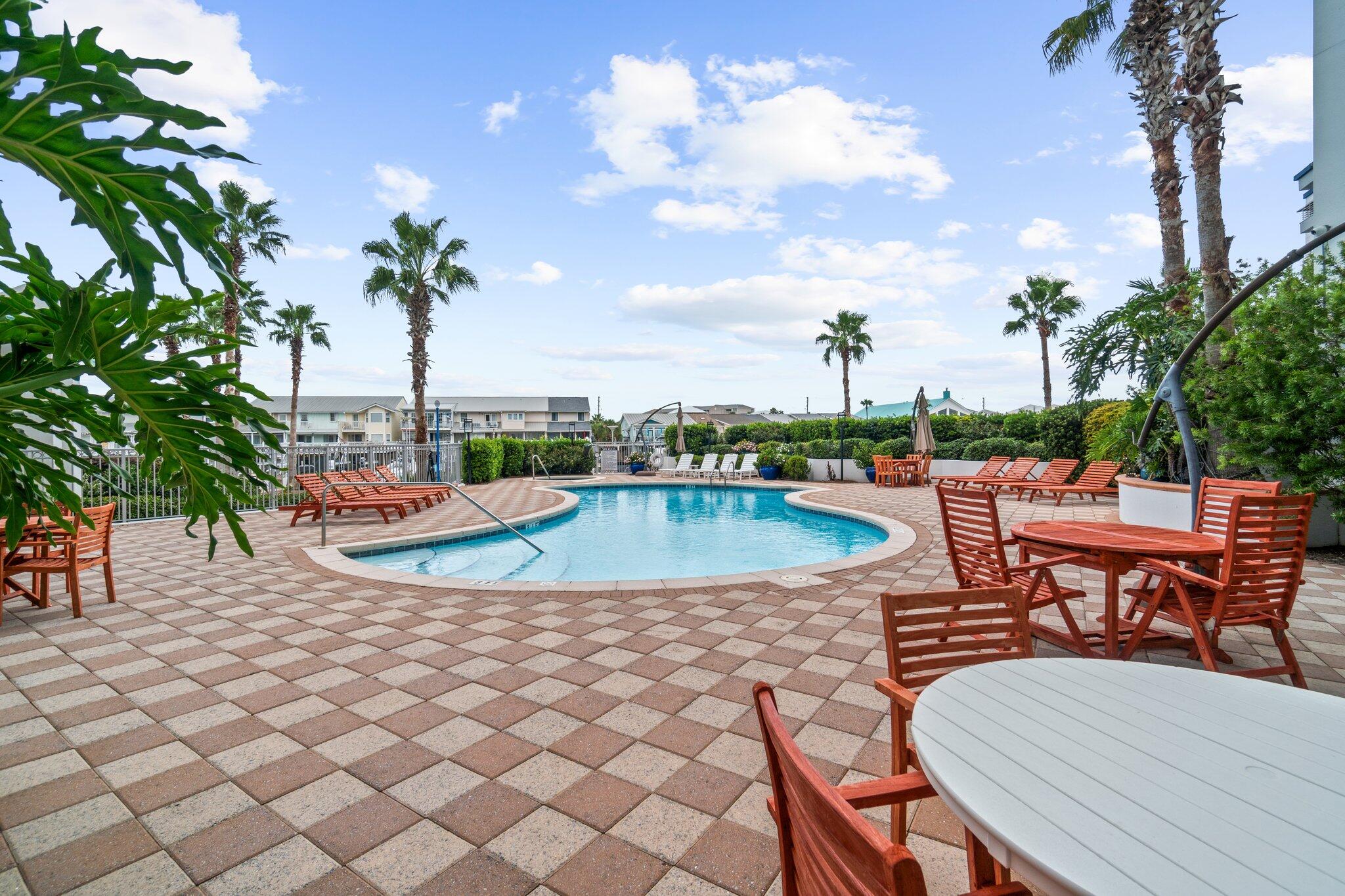 211 Durango Road, Unit 311 Destin, FL 32541 - Photo 66 of 71 a view of a swimming pool and lounge chairs